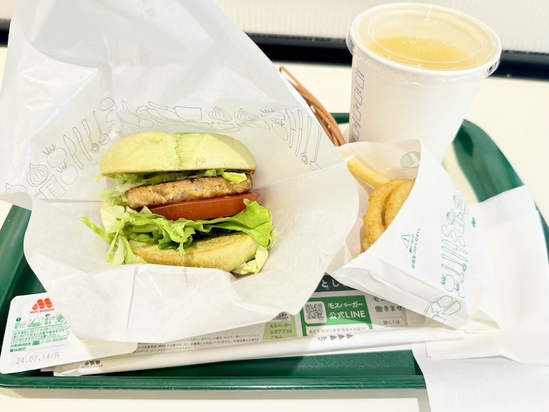Green burger with fries and drink